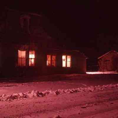 39. Zylstra House west side exterior from street, snowy night: ca. 1960