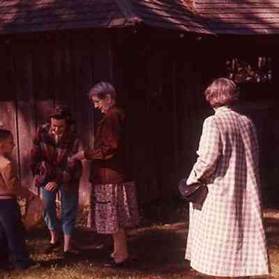 45. KJH, MCC, and others at City Park by building. Pat Boushey in plaid coat. Easter egg hunt.: City Park - April 1958
