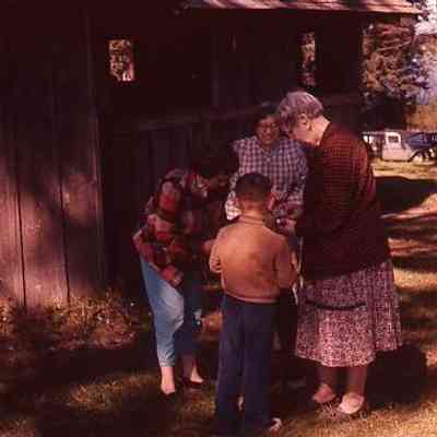 47. KJH, MCC, EYH, and EYH (checked coat) at City Park. Race house in background: City Park - April 1958
