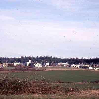 48. West side of Coupeville, church, water tower, and houses from across Kruger's field: March 1977
