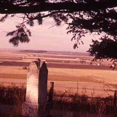 49. Ebey's Prairie from Sunnyside Cemetery looking south, grave marker in view: Sunnyside Cemetery - Oct. 1957