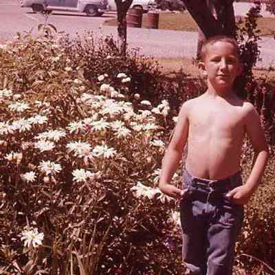 54. KJH without shirt across from old jail courthouse: ca. Summer 1958
