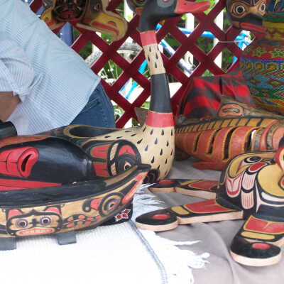 Carved masks and canoe models