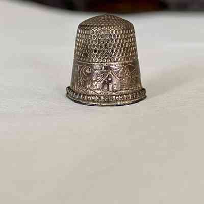 House engraving on thimble.
