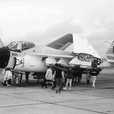 Jet with wings folded for carrier parking.