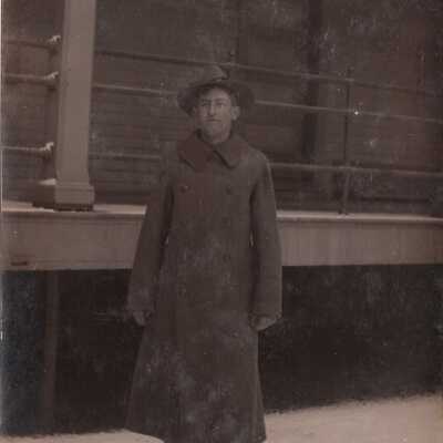 Soldier in long coat posing in snow: Origsize: 3.5x5.5; Origformat: Print-Photographic