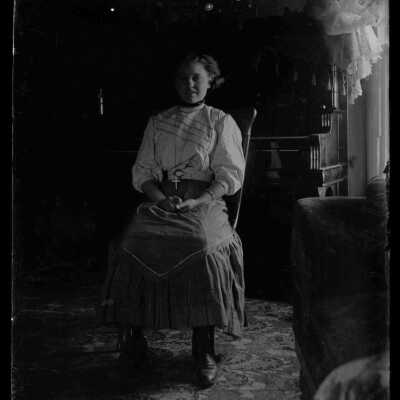 Seated woman: Origsize: 4x5; Origformat: Negative