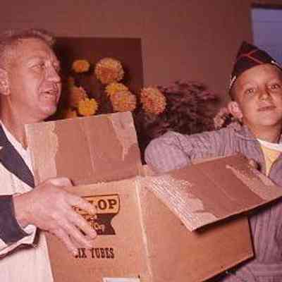 10. Brooks Service Opening Event - Sept. 1959: WKB holds box, KJH draws raffle ticket