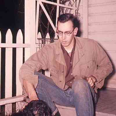 225. DJC on back porch with dog: Monk House - ca. 1959