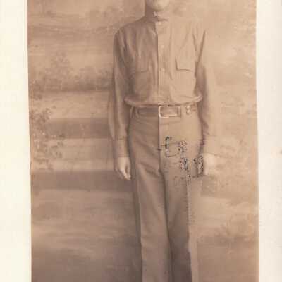 Soldier posing infront of decorative backdrop: Origsize: 3.5x5.5; Origformat: Print-Photographic