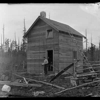 Ed Stark and his house on Hastie Lake Road: Origsize: 4x5; Origformat: Negative