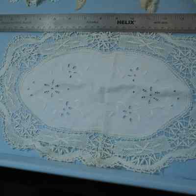 435 - doily, oval 10x15"; linen center w/ cutwork & embroidery, wide lace edge: Sally Kennedy Thompson