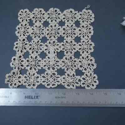 440 - doily, rayon, made up of 25 tatted medallions, ecru