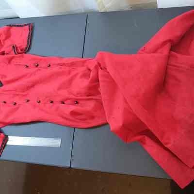 2023.dpw.375 - red short sleeve dress w/ double row of black buttons down front; trim at collar and sleeves