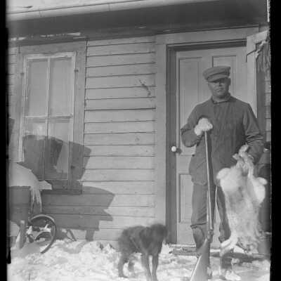 Man with gun and dog and rabbits: Origsize: 4x5; Origformat: Negative