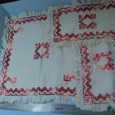 447 - doily set - 3pcs. Monk's cloth; fringed edge; cross stitch design in variegated red yarn
