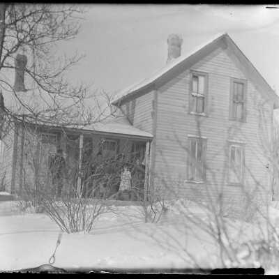 Winter farmhouse, family on porch: Origsize: 4x5; Origformat: Negative