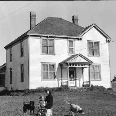 Marion Smith in front of house at Smith Farm, 1972.