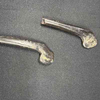 Two pieces of an unknown object.