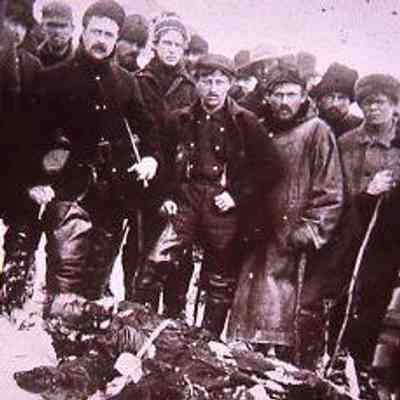 Prospectors Gather Around a Prone Man