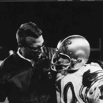 Assistant coach counsels player.