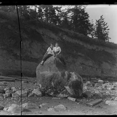 Two girls on big rock, Monroes Landing: Origsize: 4x5; Origformat: Negative