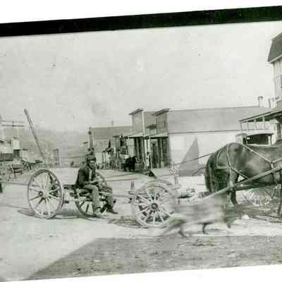 1967.ata.889b - Oak Harbor 1911, Main Street (Pioneer Way) with John Van Dyke and his team and wagon: Also Pete Hokbergen in left foreground who lived here at that time with his father and brother, Henry.