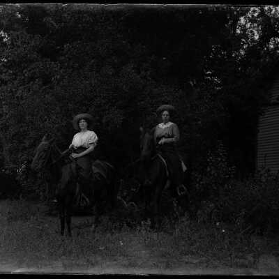 Two women on horses: Origsize: 4x5; Origformat: Negative