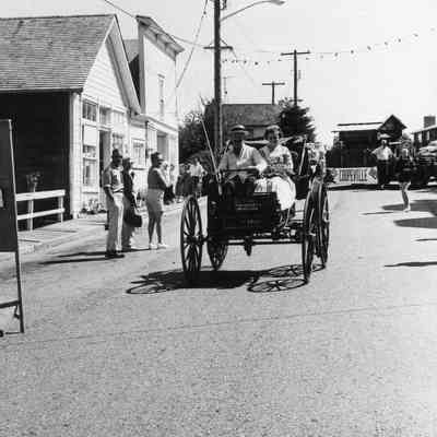 Holsman car in parade on Front Street.