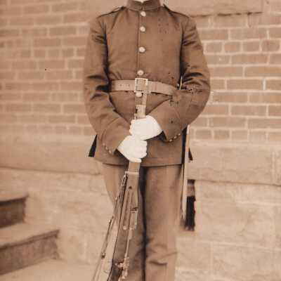 Soldier posing with rifle: Origsize: 3.5x5.5; Origformat: Print-Photographic