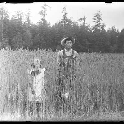 Farmer and little girl in tall grass: Origsize: 4x5; Origformat: Negative