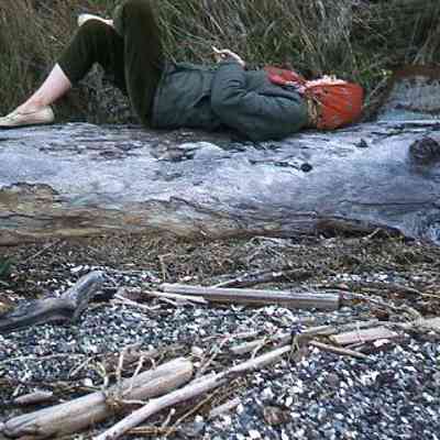 197. JJC laying on log on beach: Central Whidbey - July 1961