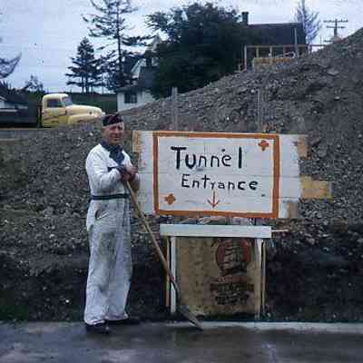 260. WKB at Brooks Service on Main Street, standing by fake "tunnel" entrance: Main Street - ca. 1960