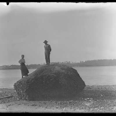 Couple on big rock at Monroes Landing: Origsize: 4x5; Origformat: Negative