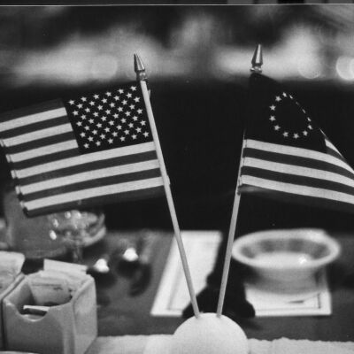 13-star and 50-star flags adorn the tables.