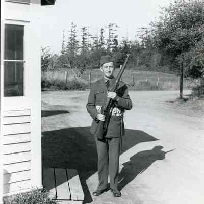 Soldier Posing with Rifle at Fort Casey