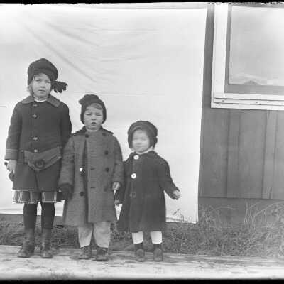 Three small children infront of sheet: Origsize: 4x5; Origformat: Negative