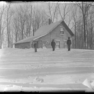 Children outside house, deep in snow: Origsize: 4x5; Origformat: Negative