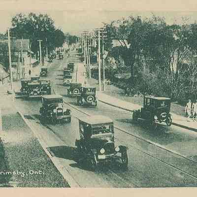 Cars Driving Down Main Street - circa early 1930s