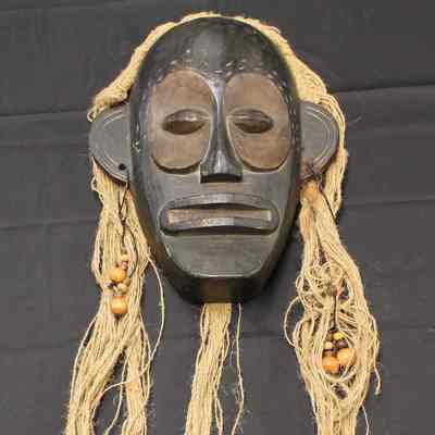 Black mask with hair and earrings