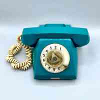 Rotary-dial desk telephone, teal plastic
