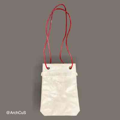 PVC shoulder bag with red cord handles