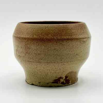 Wheel-thrown stoneware vessel (footed cup/bowl), speckled buff glaze