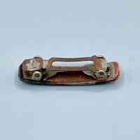 Hair barrette with dark plastic cover and metal spring clasp - Image 2