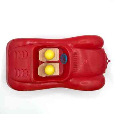 Child's plastic toy car with two peg figures
