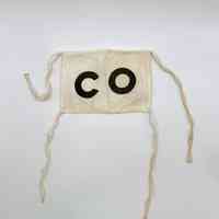 Cloth armband (brassard) lettered "CO" — Comité/Comisión Organizadora