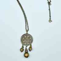 Name Pendant necklace with openwork floral medallion and bead drops