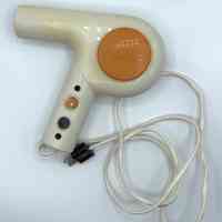 "Diana" handheld (pistol-grip) electric hair dryer – cream with orange accents - Image 3