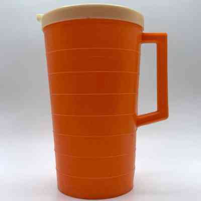 Lidded plastic pitcher, ribbed (orange with ivory lid)