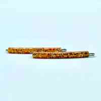 Confetti-lucite "Flower Brand" hair pins (amber/gold, pair), on original card